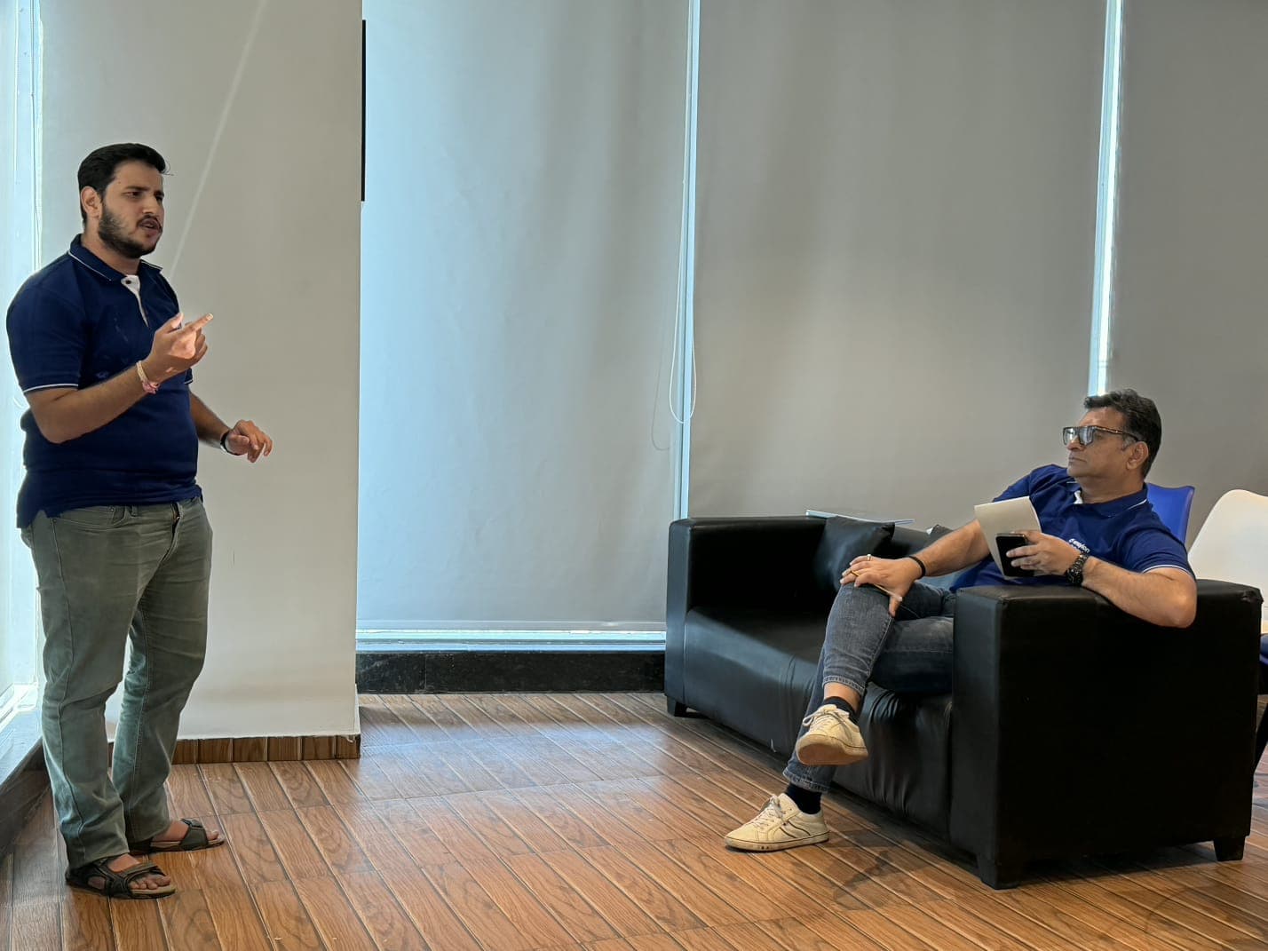 A Team CommIQ member explaining the solution to a seated judge