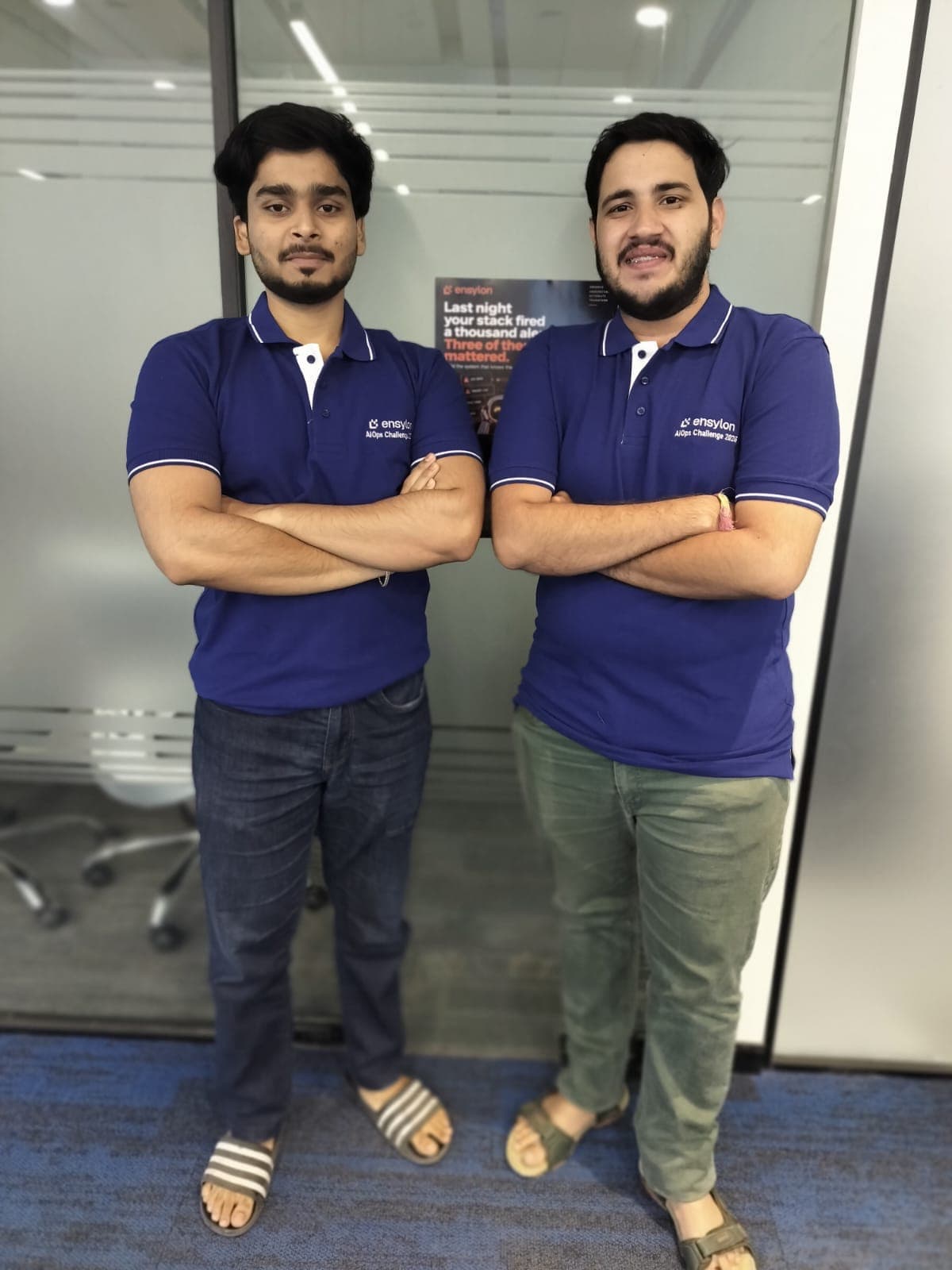 The two members of Team CommIQ in Ensylon AIOps Challenge 2026 shirts