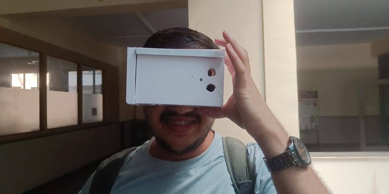 Wearing the smart-glasses prototype, front view, with the sensor openings facing forward